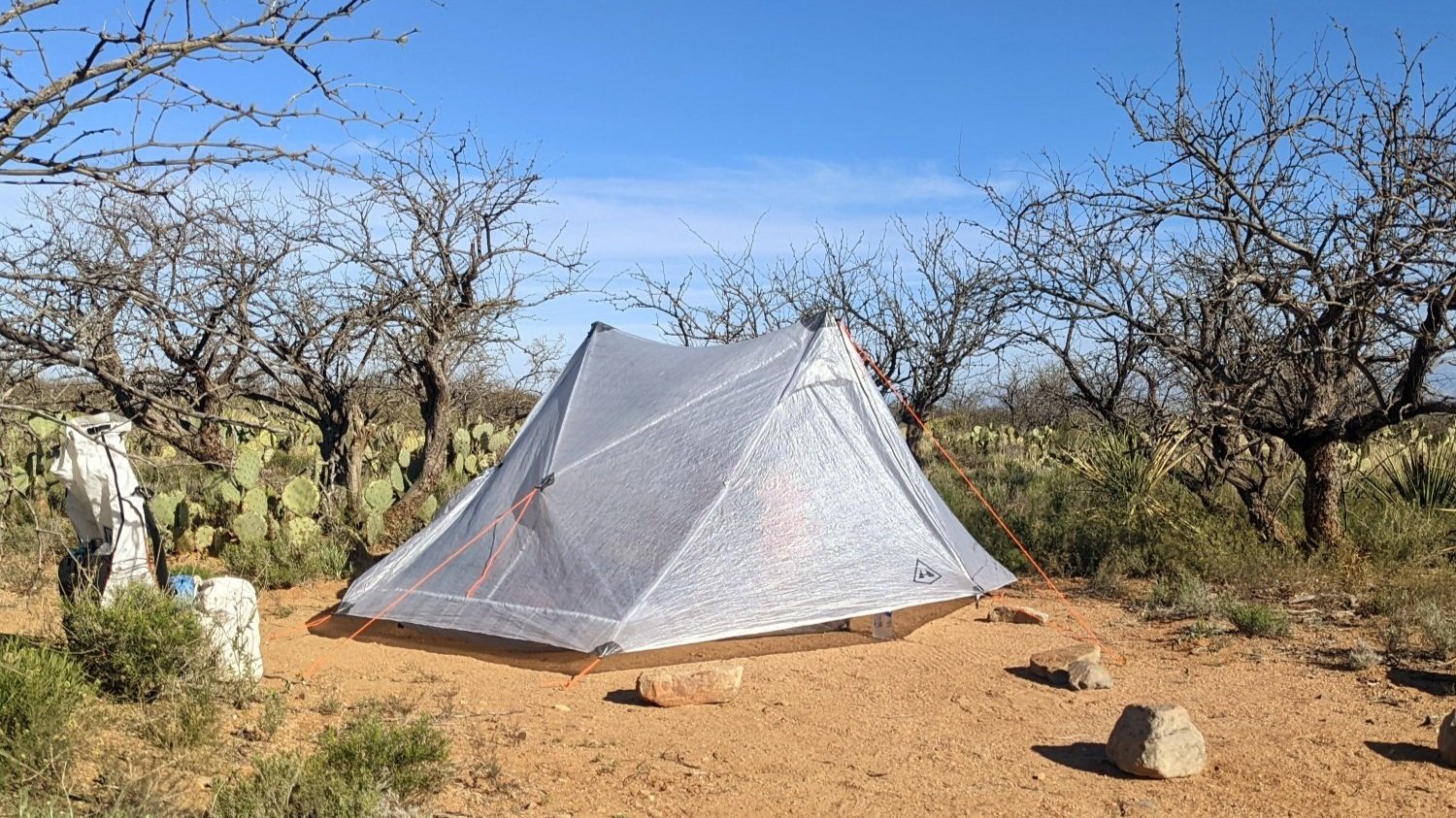 The Hyperlite Mountain Gear Unbound 2 tent pitched taut in a campsite surrounded by cacti