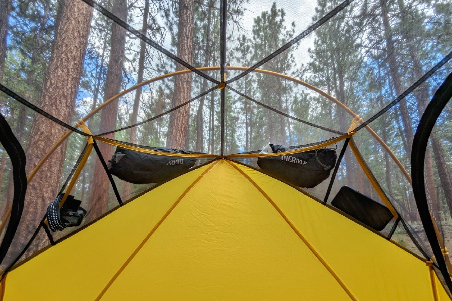 An interior view of the REI Flash 2 Tent looking at the headwall with four pockets lining the top