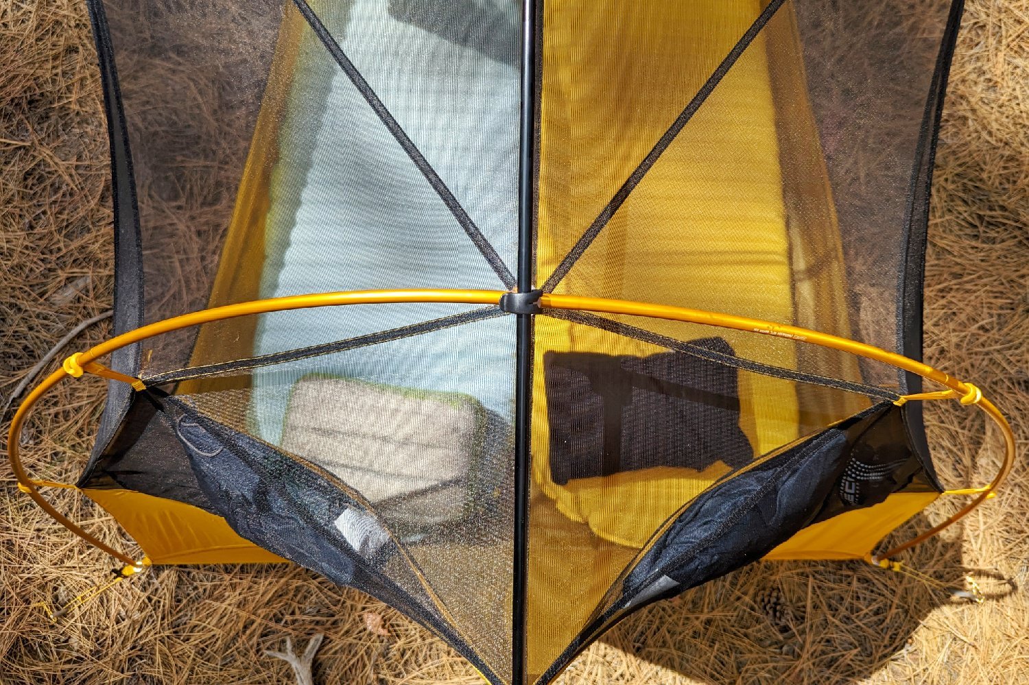 A top down view of the arch pole at the head of the REI Flash 2 Tent