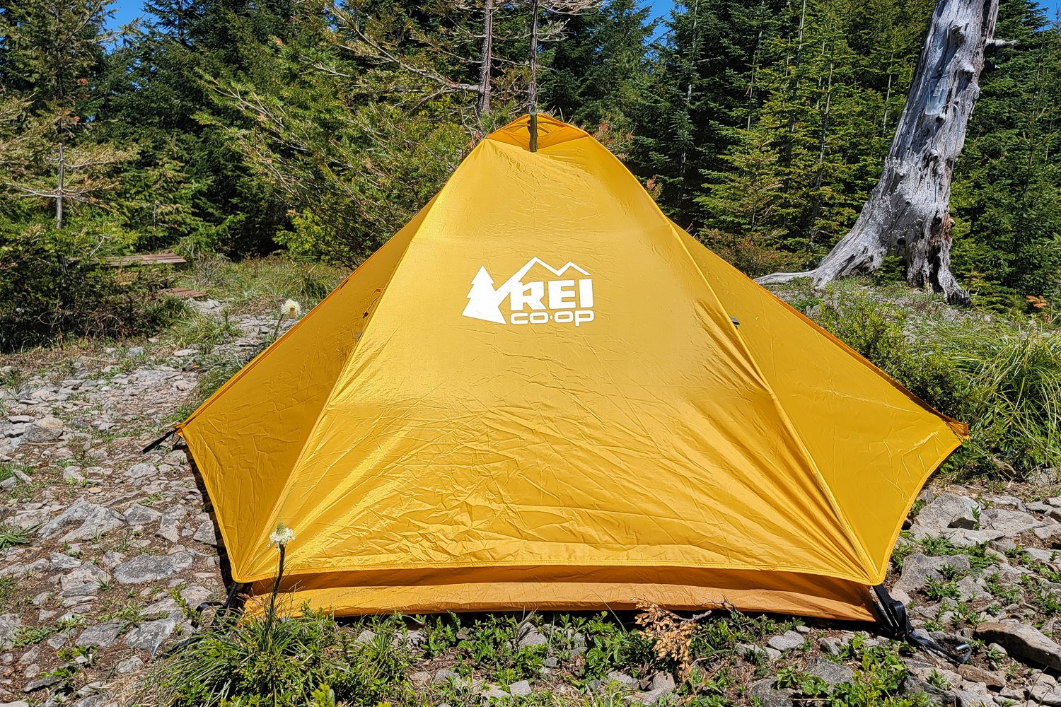 A side view of the REI Trailmade 2 tent with the rain fly on