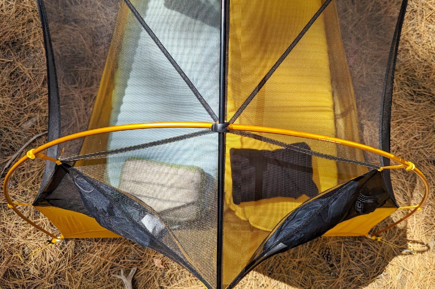 A top down view into a tent - the Therm-a-Rest NeoAir Xtherm NXT and Therm-a-Rest XLite NXT are set up side by side with pillows on them