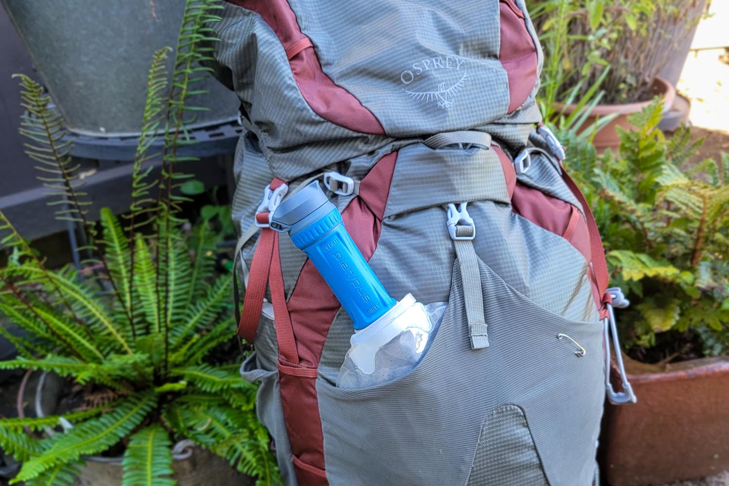 The Platypus QuickDraw in the mesh pocket on the Osprey Eja backpacking pack