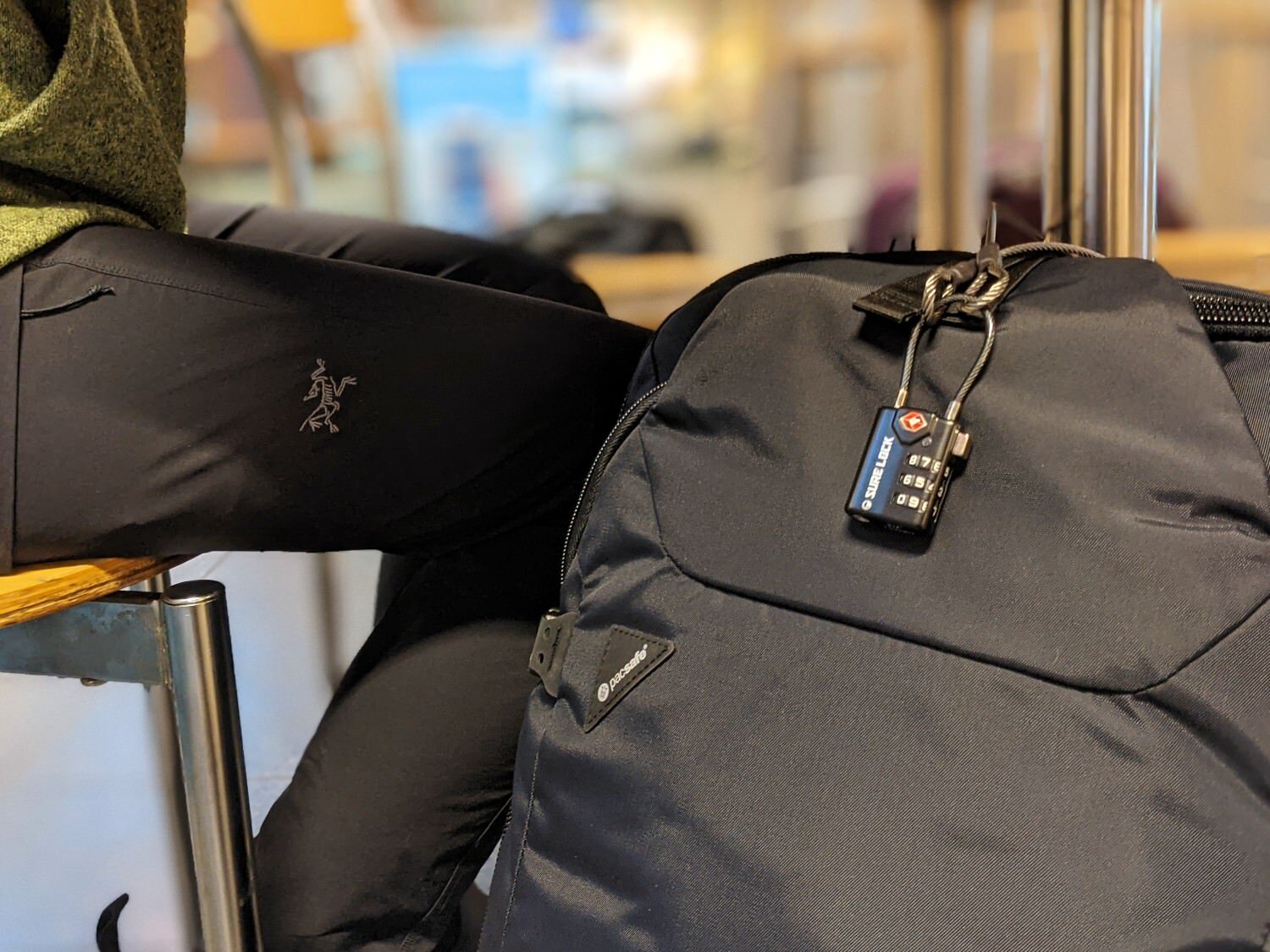 You can use small luggage locks to lock the zippers on your duffel bag
