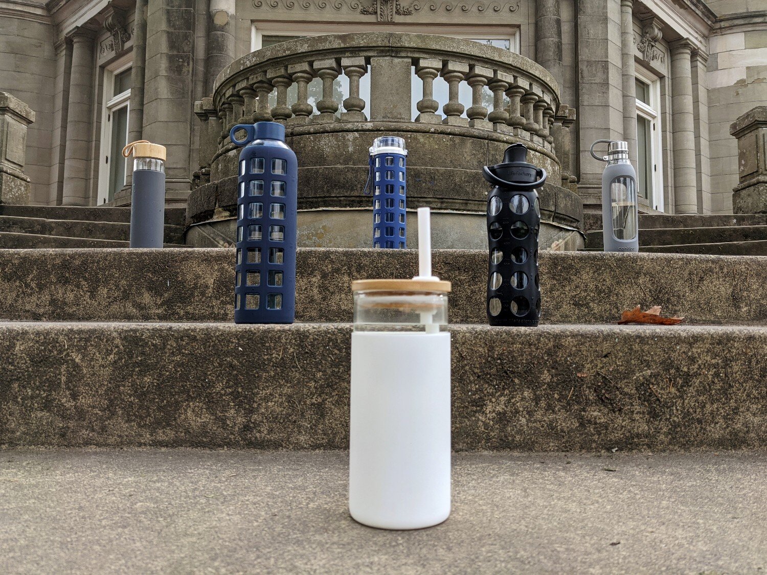 https://www.cleverhiker.com/wp-content/uploads/2023/08/A-group-of-glass-water-bottle-arranged-on-steps.jpeg