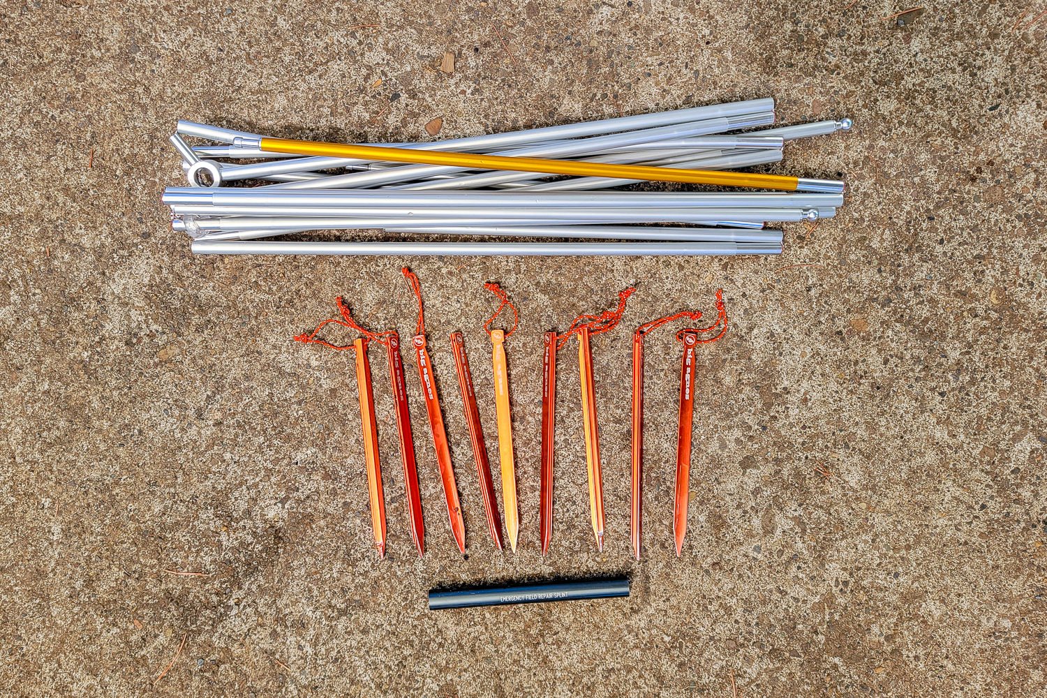 Closeup of the broken-down tent poles, stakes, and pole splint that come with the BA Tiger Wall UL2