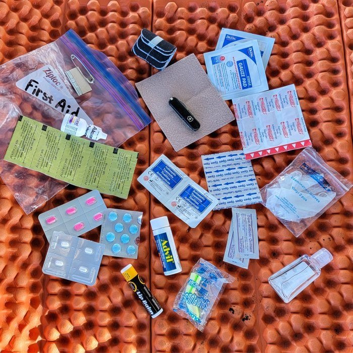 Top-down view of the contents of a homemade first aid kit