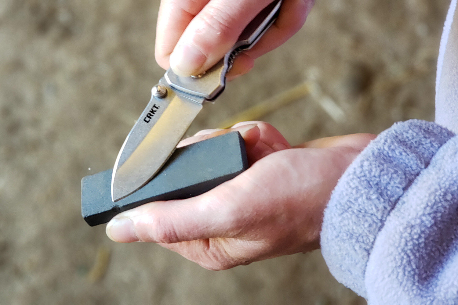 https://www.cleverhiker.com/wp-content/uploads/2023/08/Closeup-of-a-woman-sharpening-the-CRKT-Squid-Pocket-Knife.jpeg