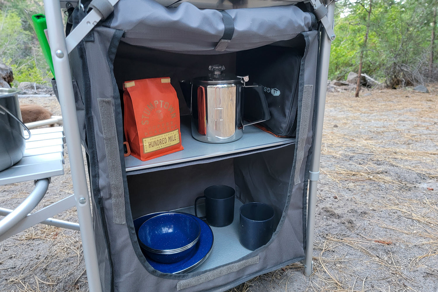 The Mountain Summit Gear Deluxe Roll Top Kitchen has a removeable storage compartment with shelves