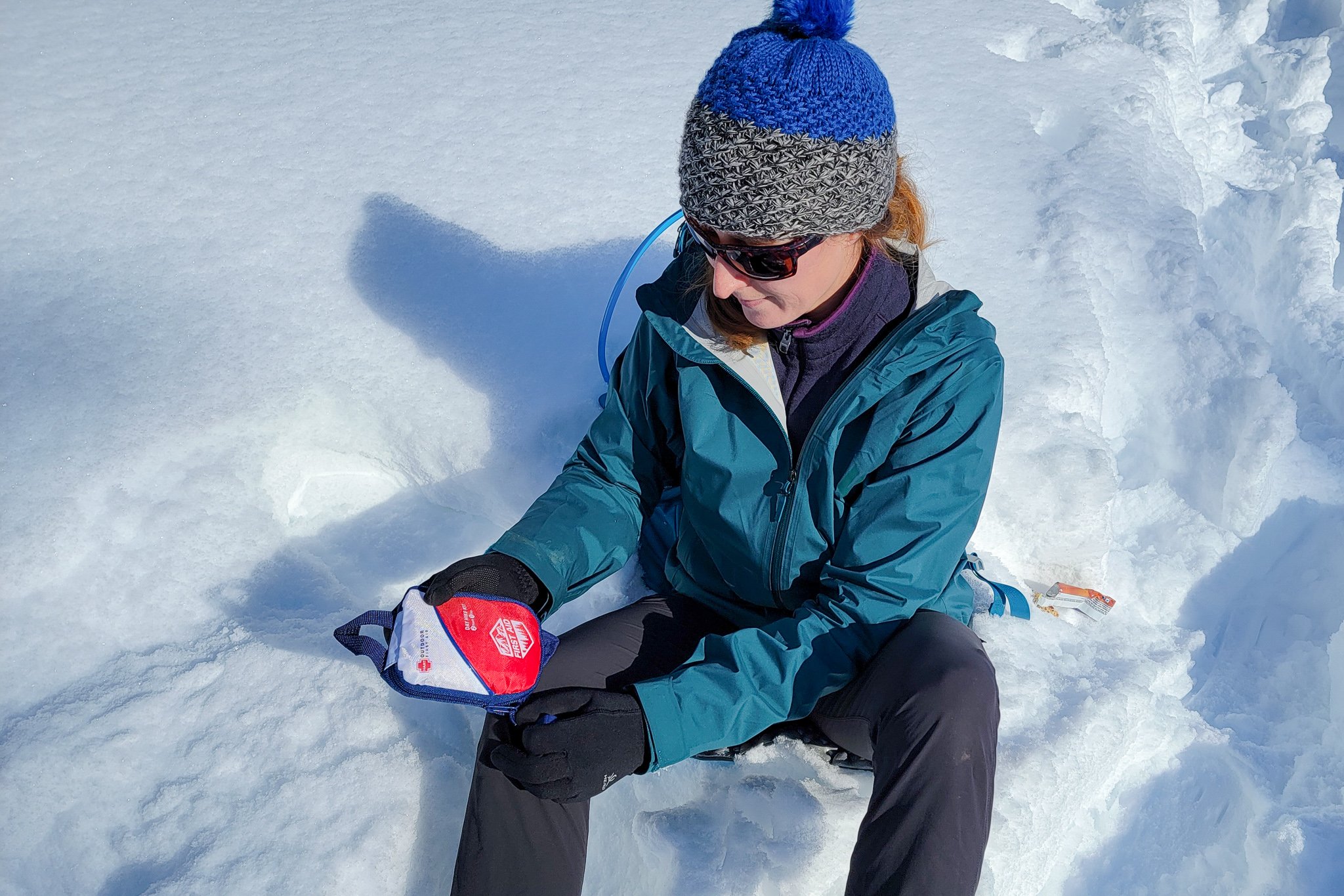 A snowshoer using the HART Day Hike Kit