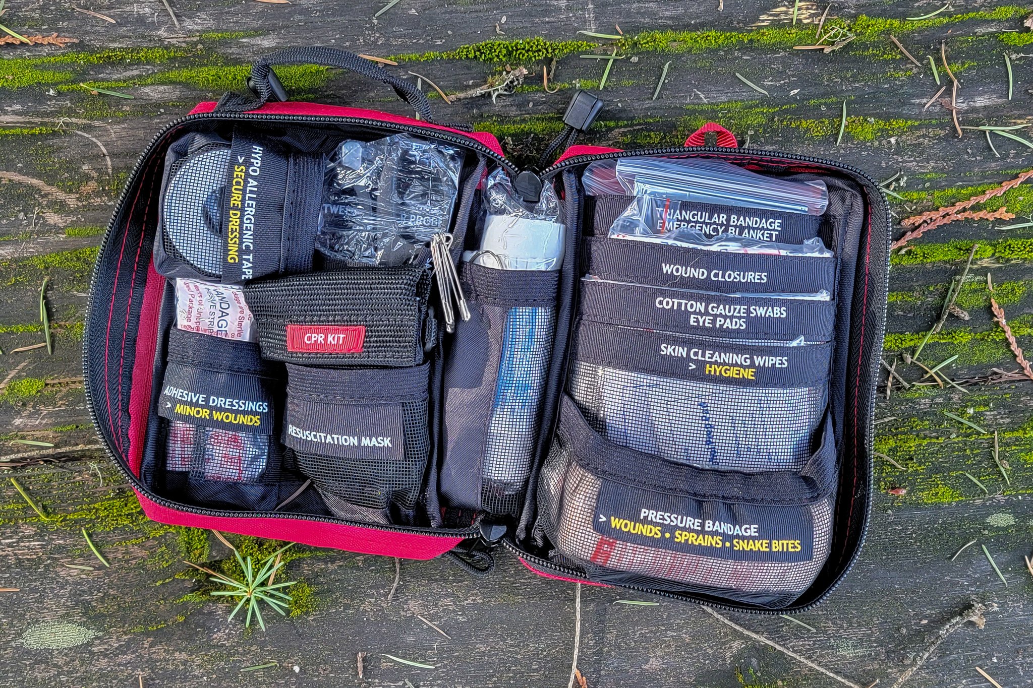 Top-down view of the Surviveware Small First Aid Kit's contents