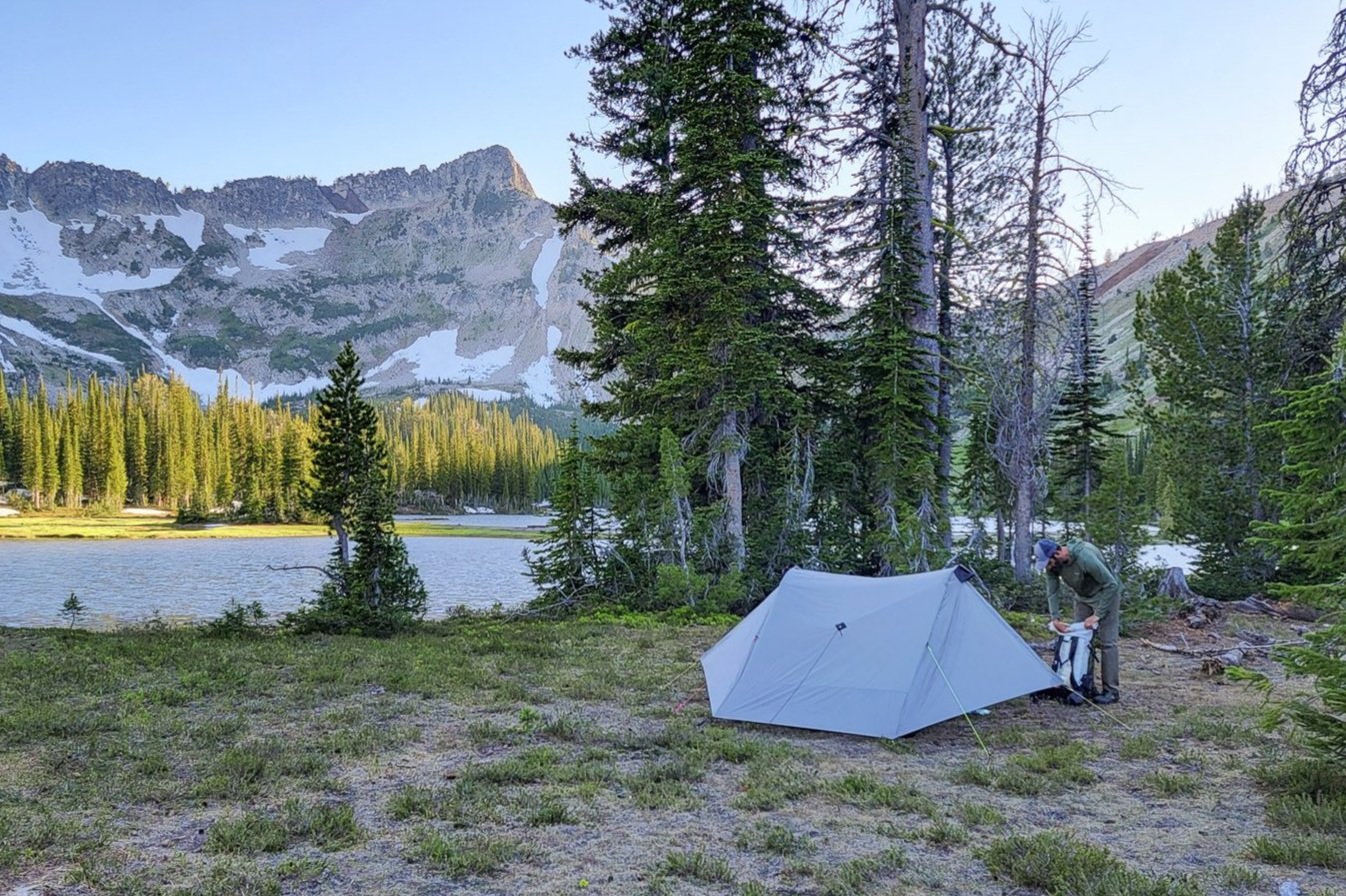 A scenic shot of the SMD Lunar Duo near and alpine lake surrounded by mountains