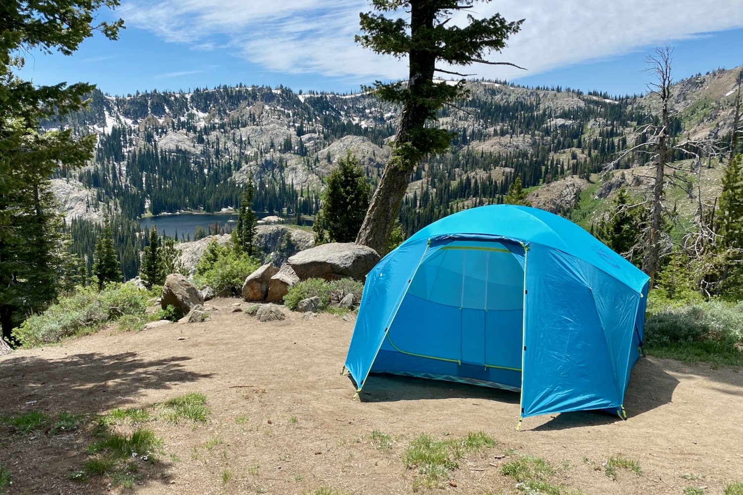 The NEMO Aurora Highrise Tent in a campsite above a lake