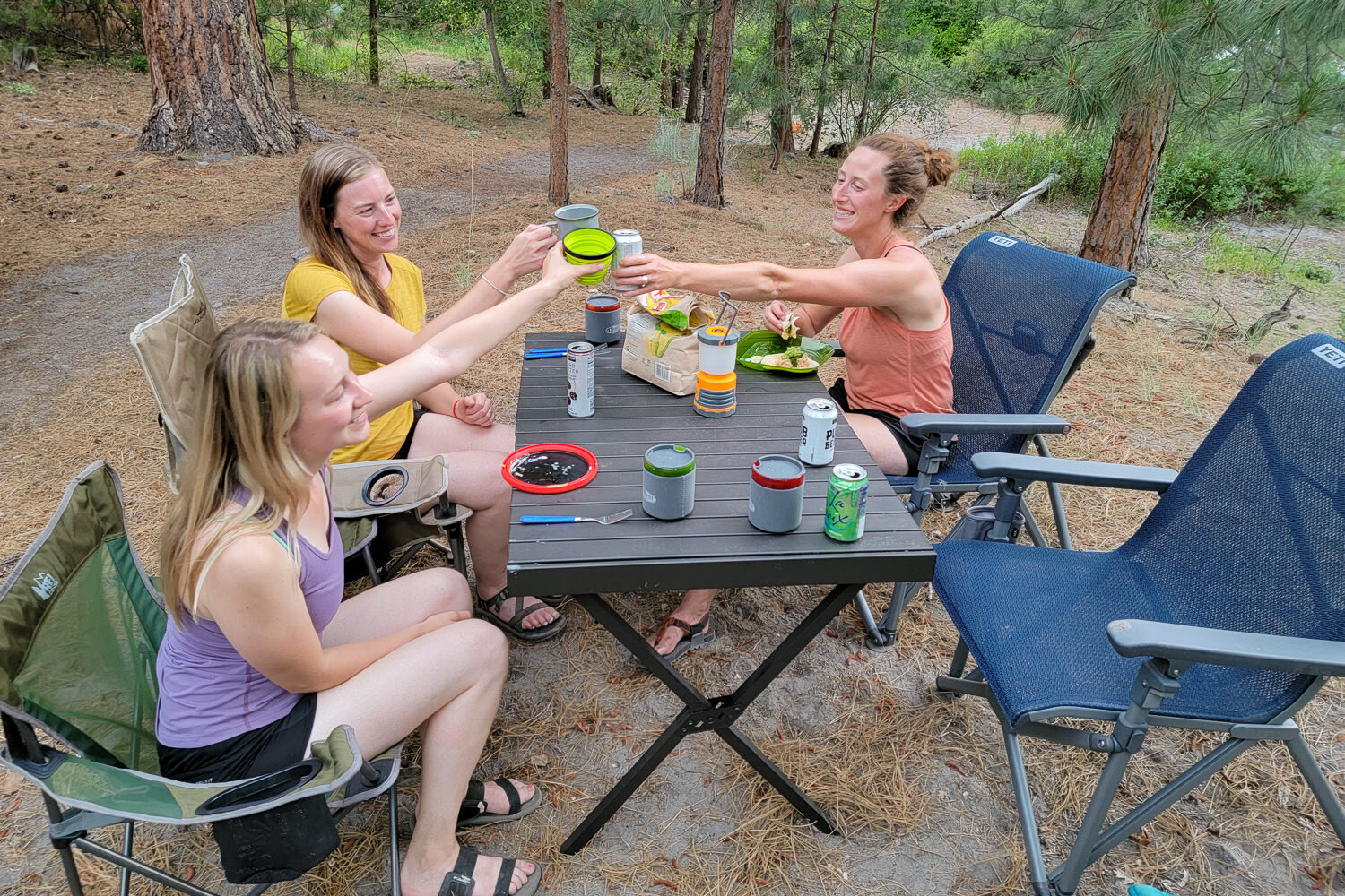 The ALPS Mountaineering Dining Table has a large tabletop that’s great for group meals & games