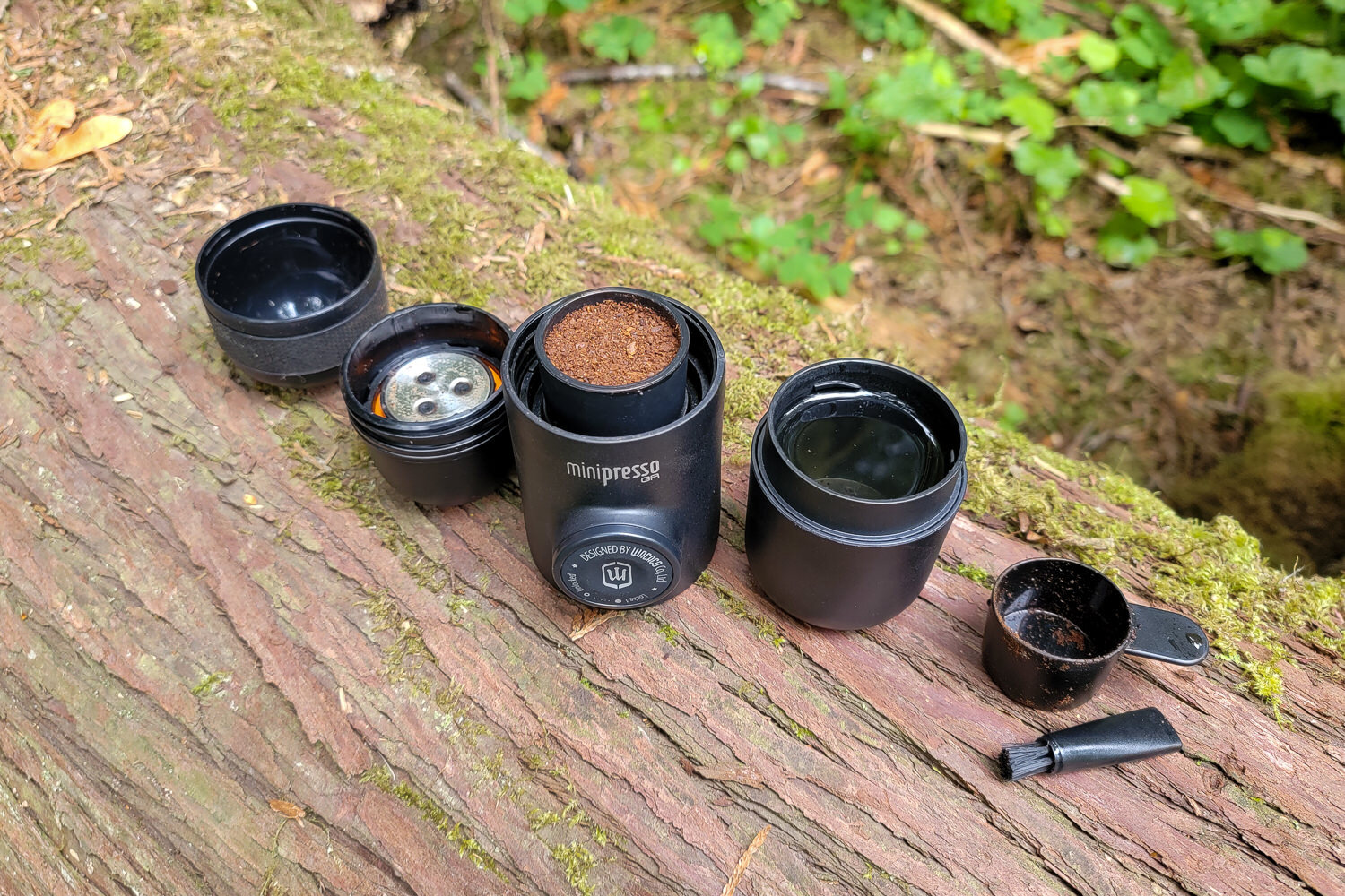The Wacaco Minipresso GR comes with its own cup, scoop & even a brush