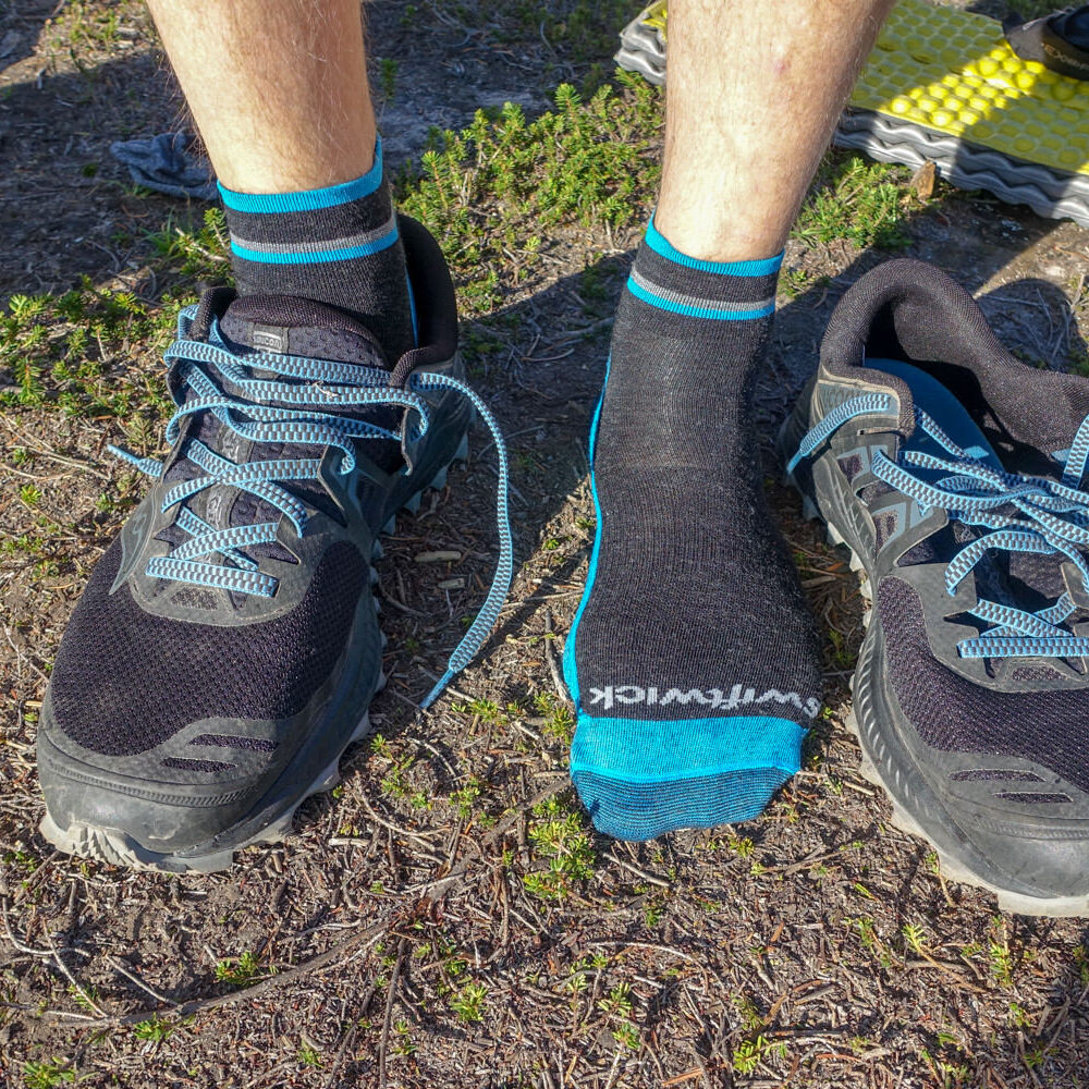 Closeup of a hikers feet in the Swiftwick PURSUIT HIKE Two Ultra Light Socks