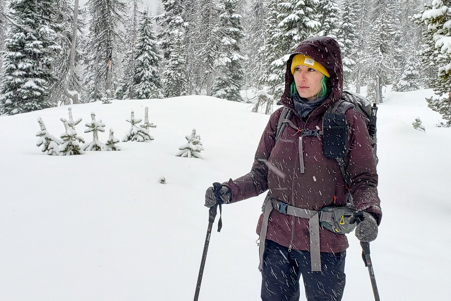 A woman hiking in the snow