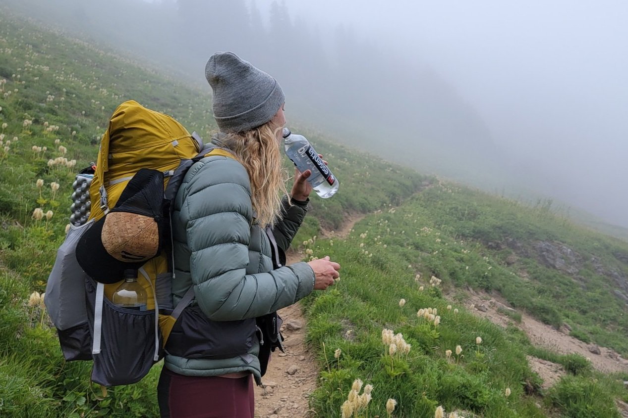 A backpacker wearing a down jacket