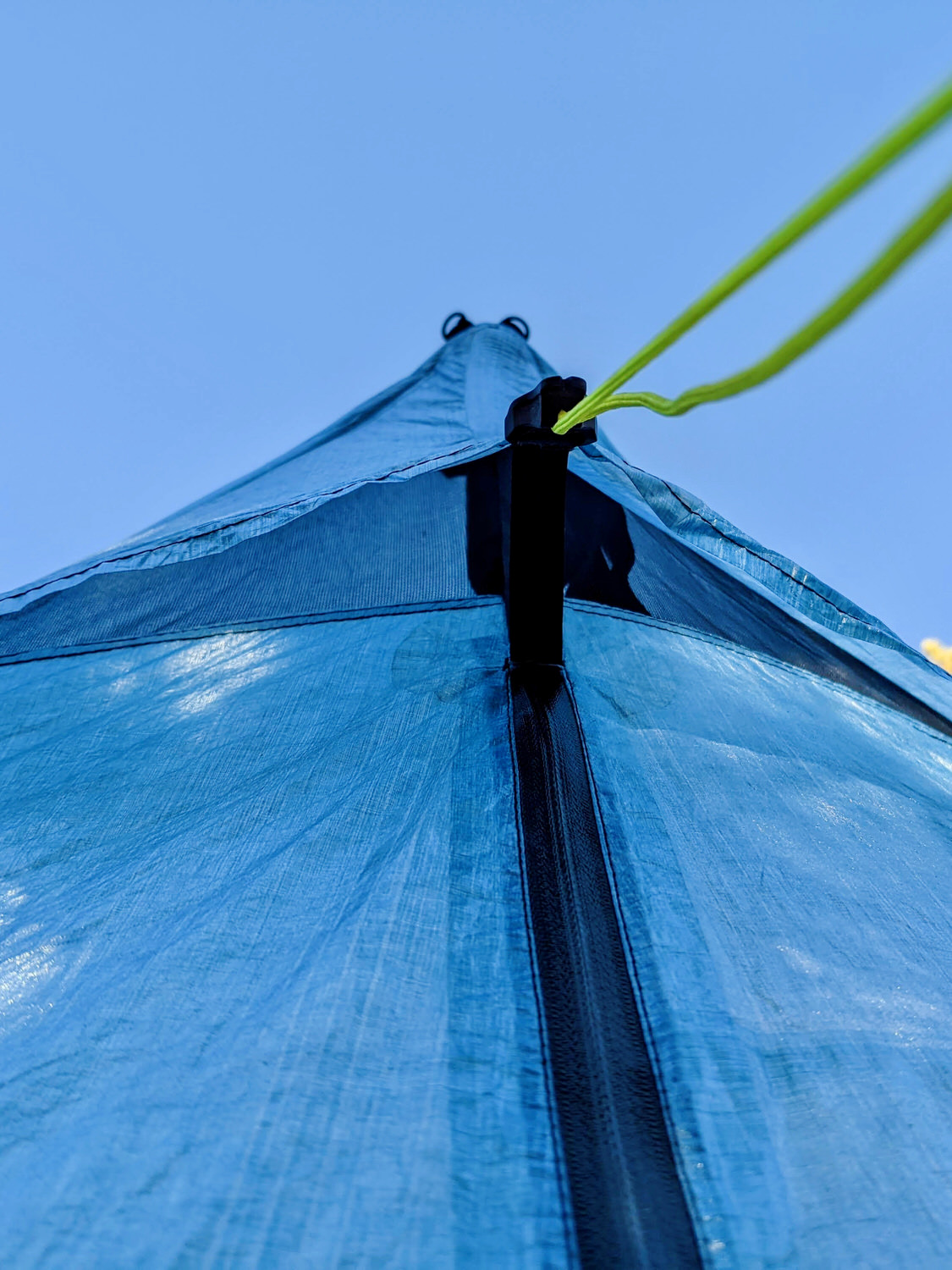 The top peak with ventilation of the Zpacks Duplex Zip tent with blue sky in the background