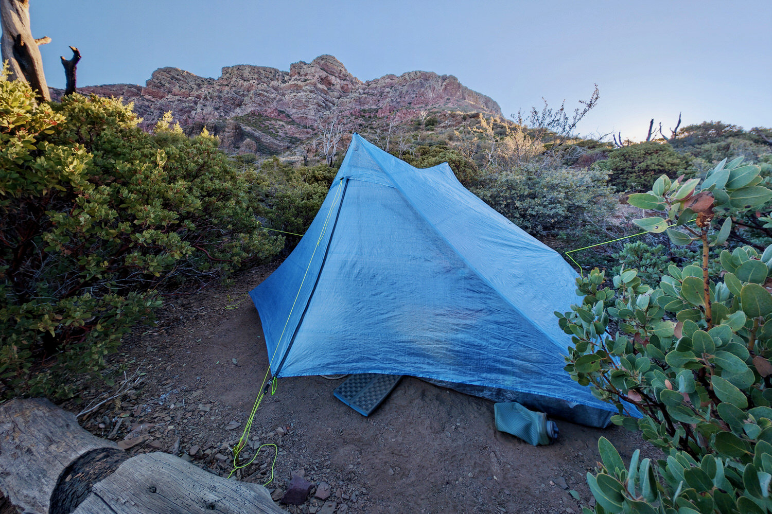 The Zpacks Duplex Zip tent in the early morning light with mountains rising over the tent in the background