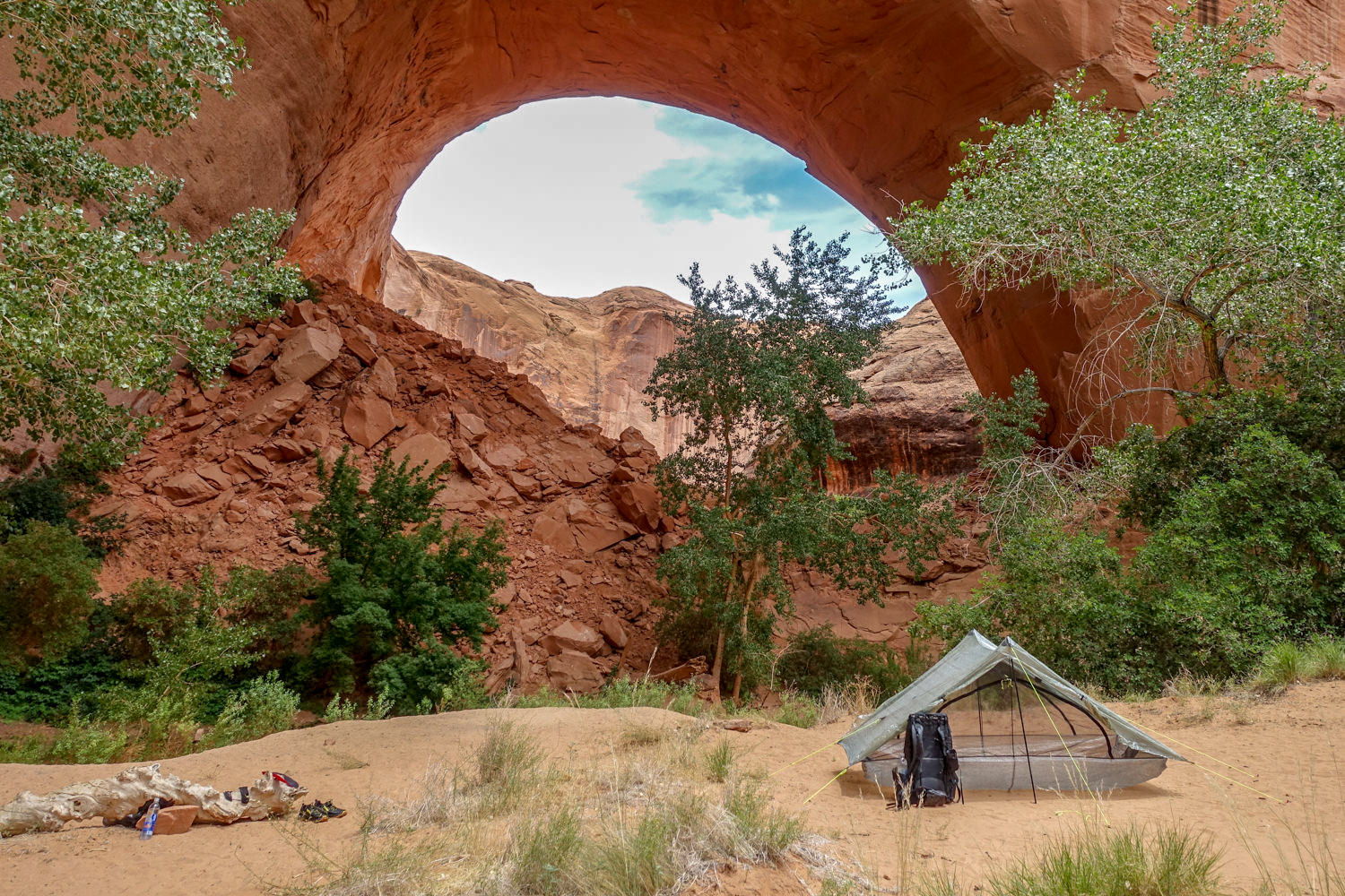 The Zpacks Duplex pitched near a red rock arch in Coyote Gulch