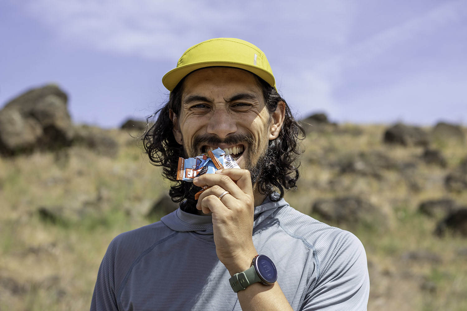 A runner eating a Clif Bar