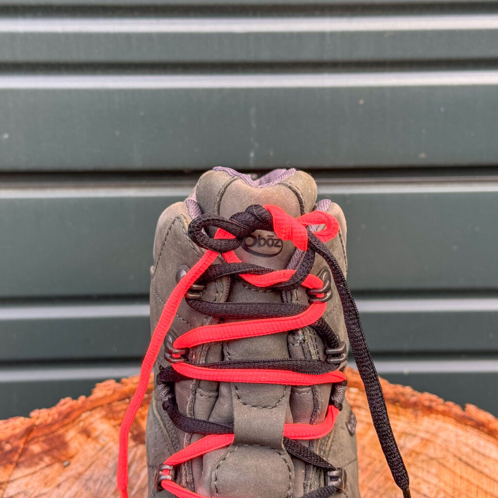 Dual-colored shoelaces demonstrating how to tie a double slipknot on the men's Oboz Bridger 8” BDry Insulated winter boots