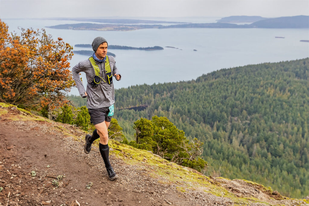 A marathon runner in an Ultimate Directions running vest