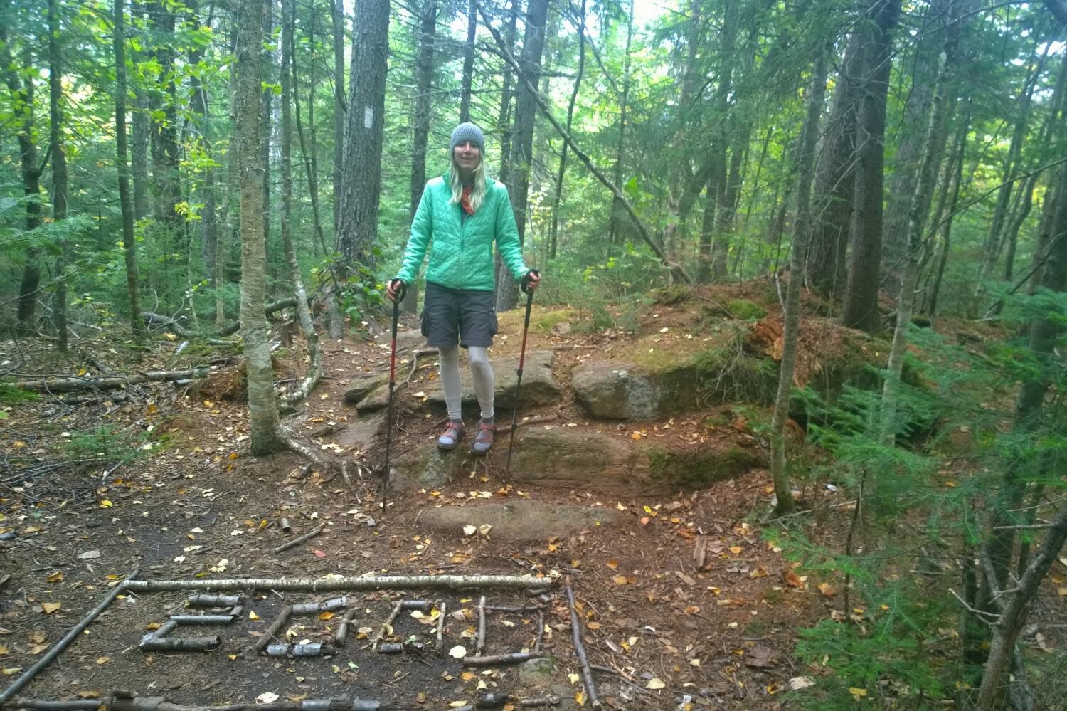 Appalachian Trail thru-hiker makes the number 2000 out of sticks on the ground to celebrate hiking 2000 miles.