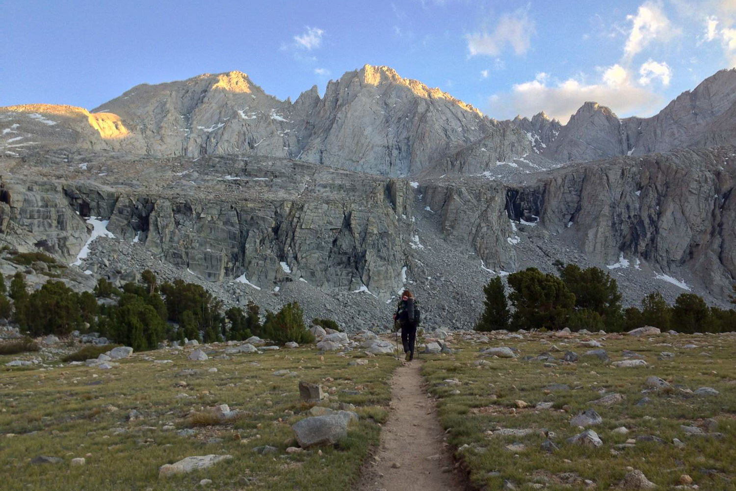 trail headed for the mountains with a thru-hiker walking