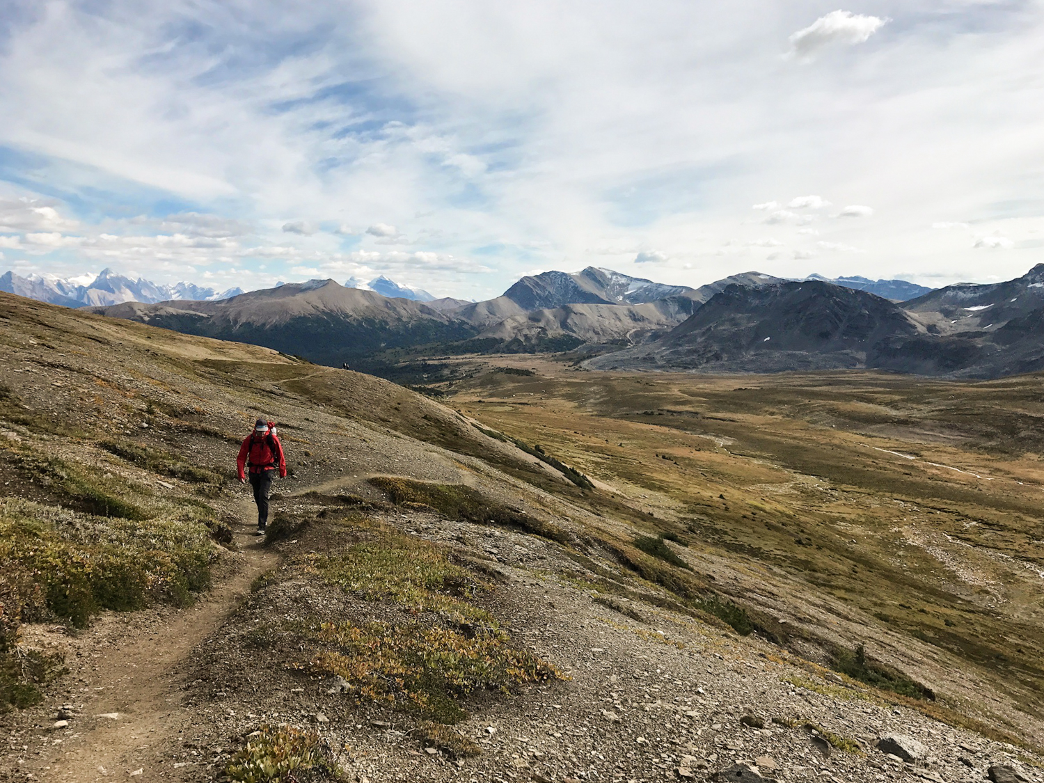 a backpacker walking through the mountains of jasper national park