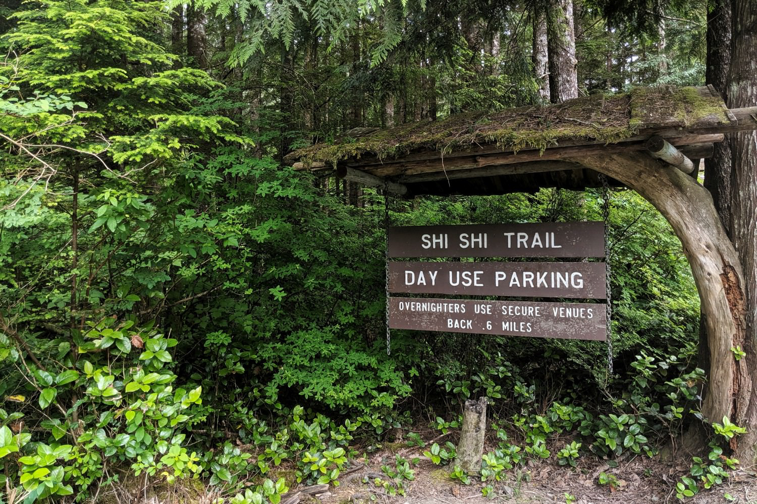A trailhead sign advises visitors to use secure overnight parking nearby.