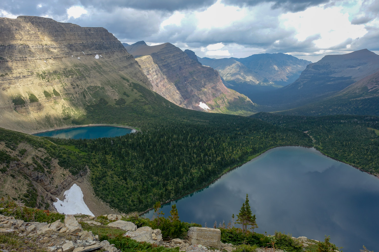 the view from above two alpine lakes in glacier national park