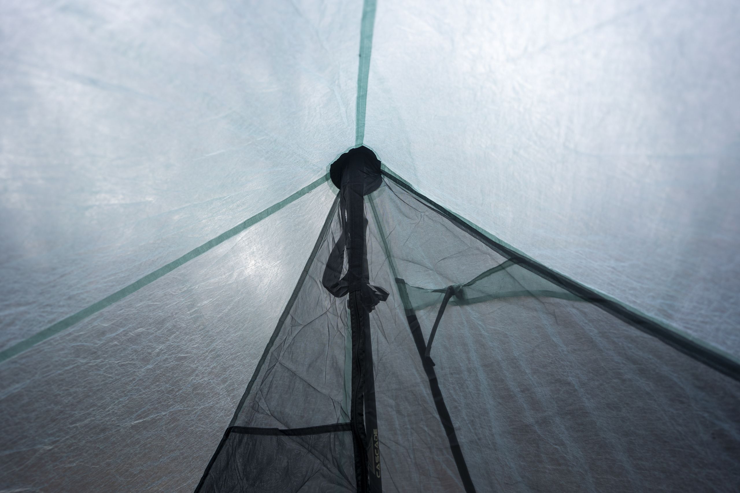 a view from inside a two person tent looking at a peak