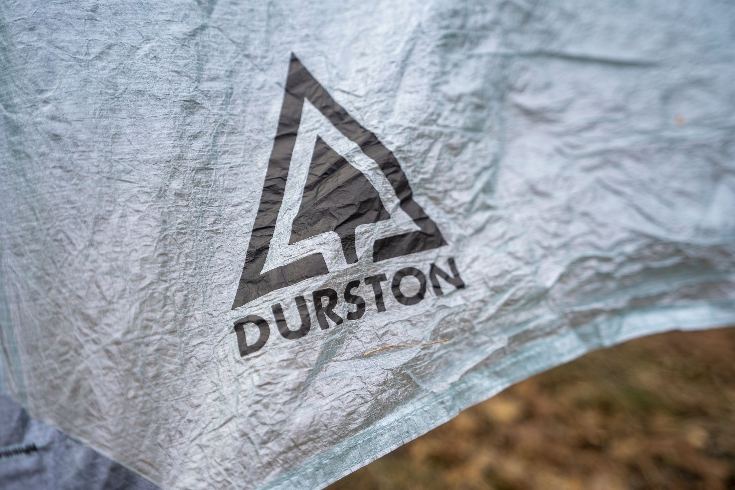 a logo of a company on a tent