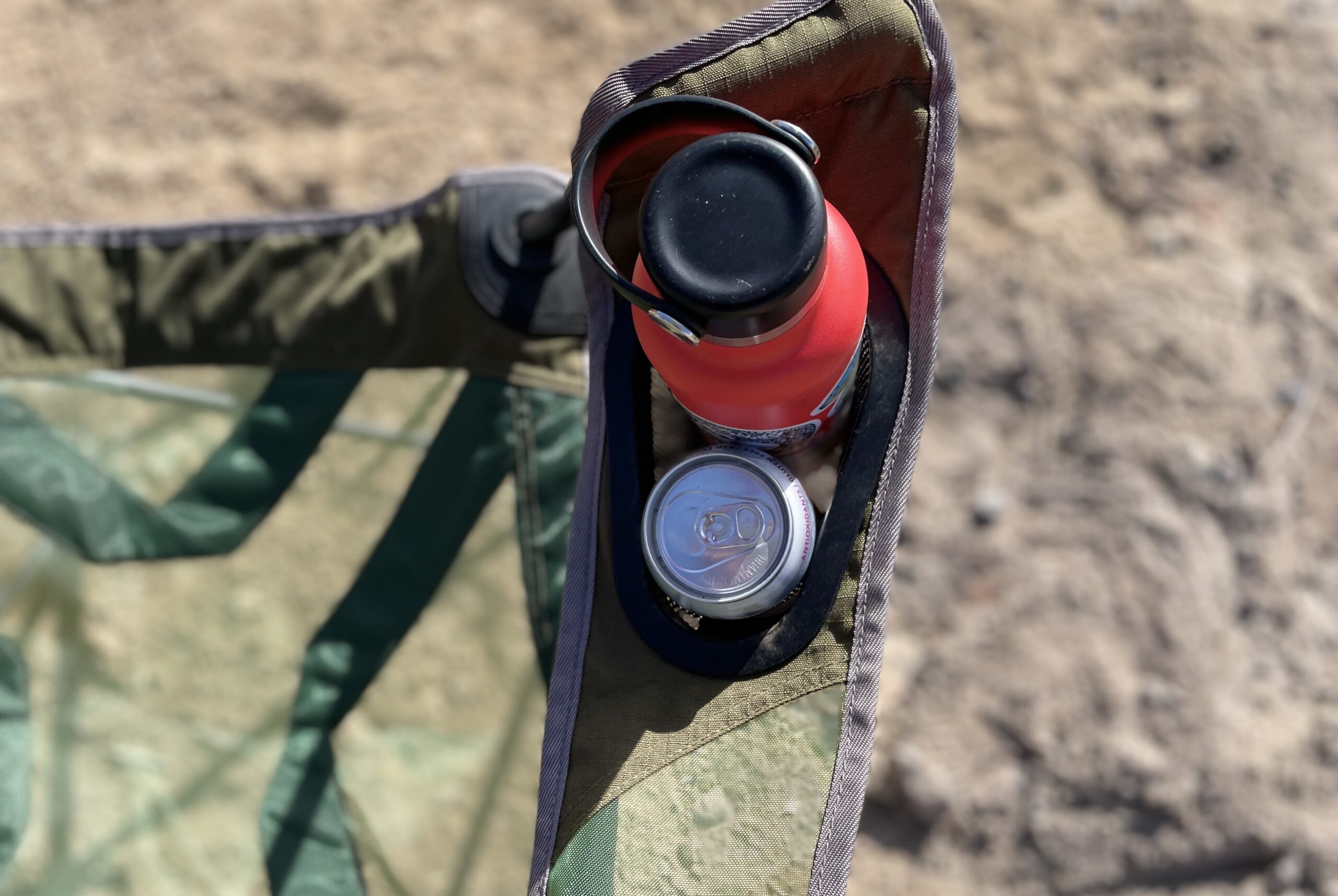 Close up of the cupholder of a camping chair.