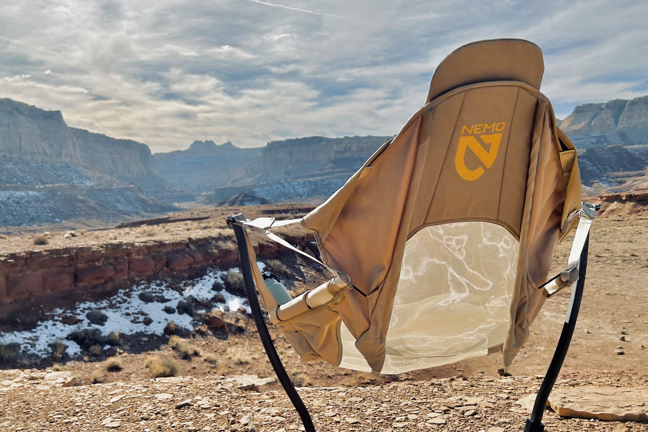 A camping chair from behind in a sunny desert setting.