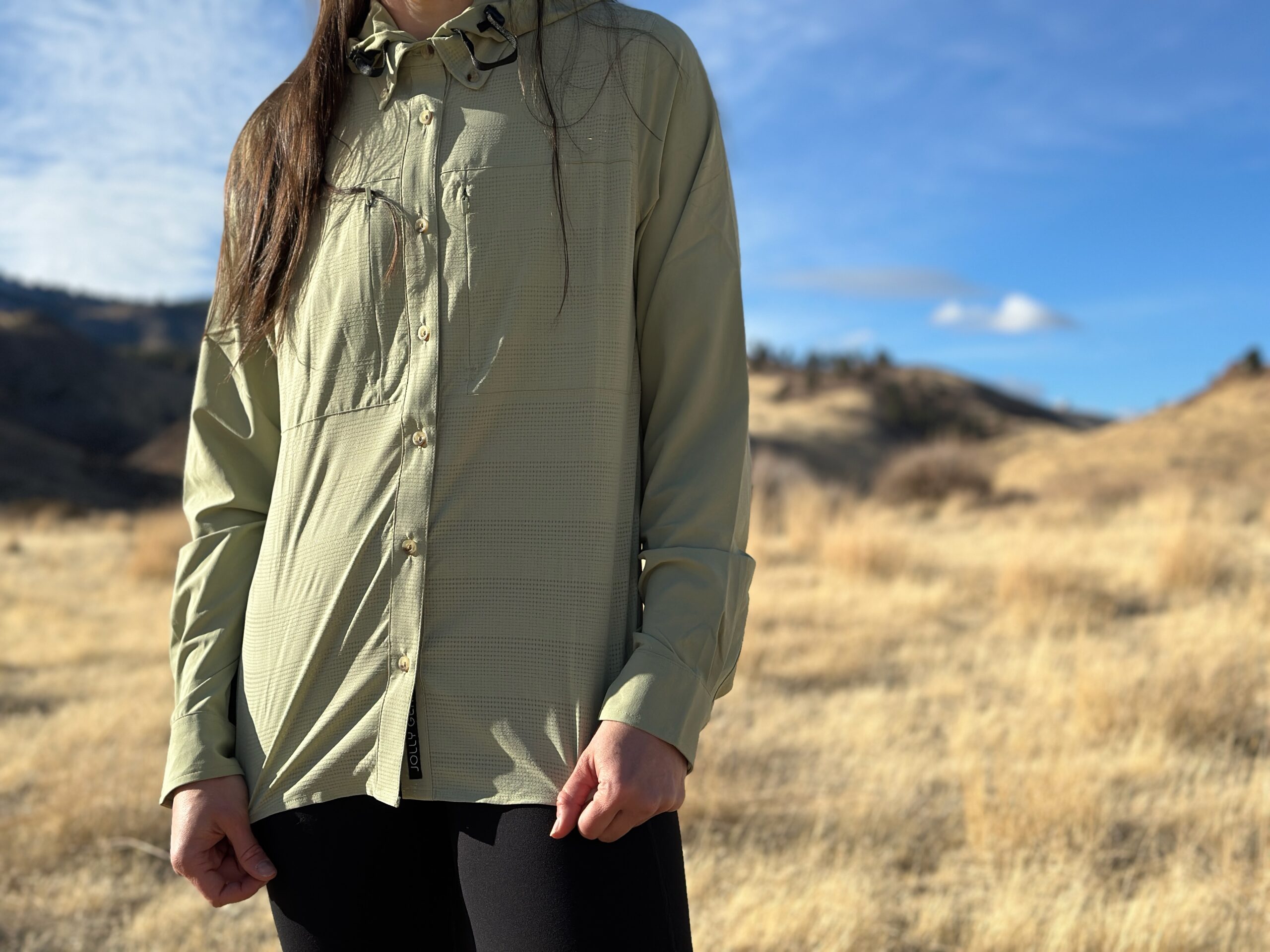 woman hiking in high desert with backpack on