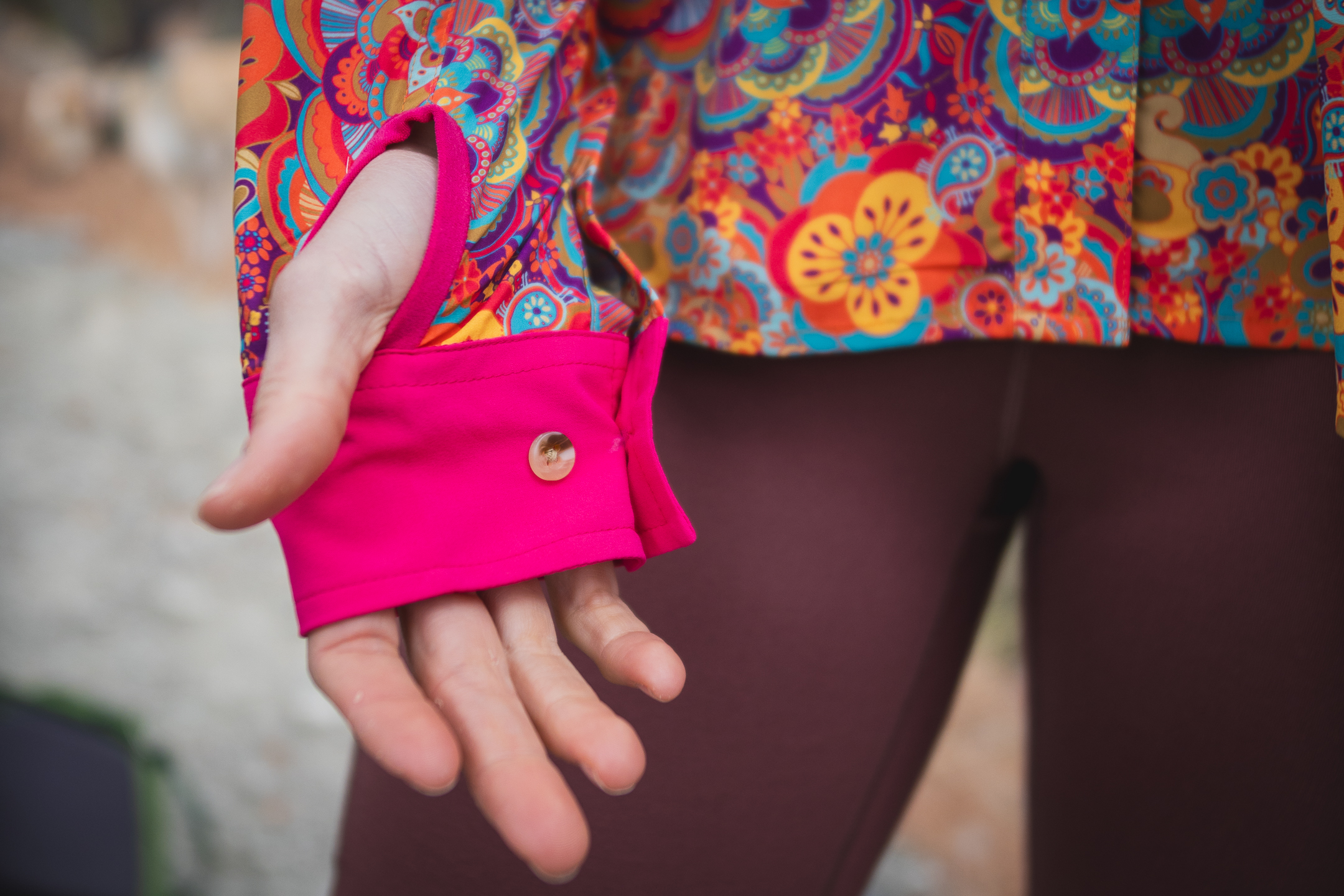 woman hiking with colorful shirt in pine forest
