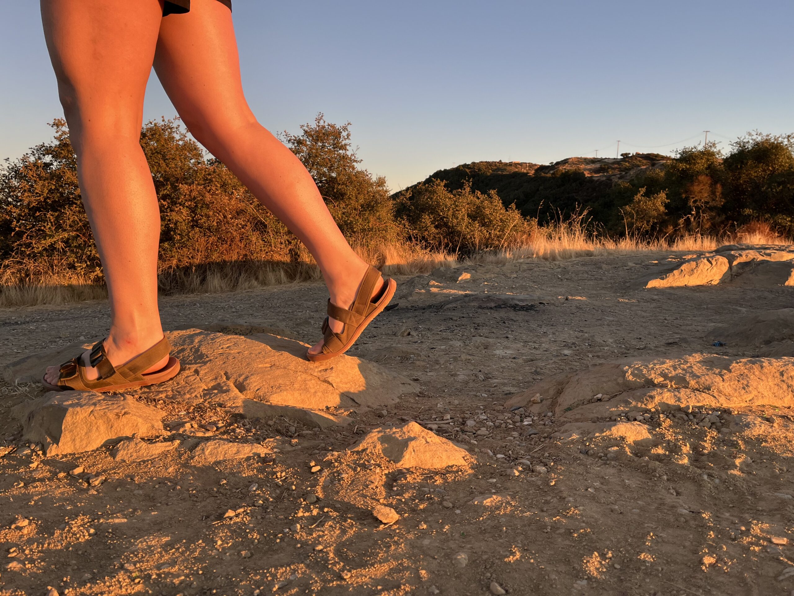 Our tester wearing the Astral Webber sandals on a hike.