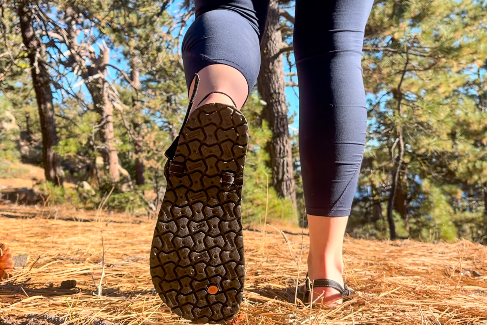 Our tester wearing the Earth Runner Alpha sandals on a hike.