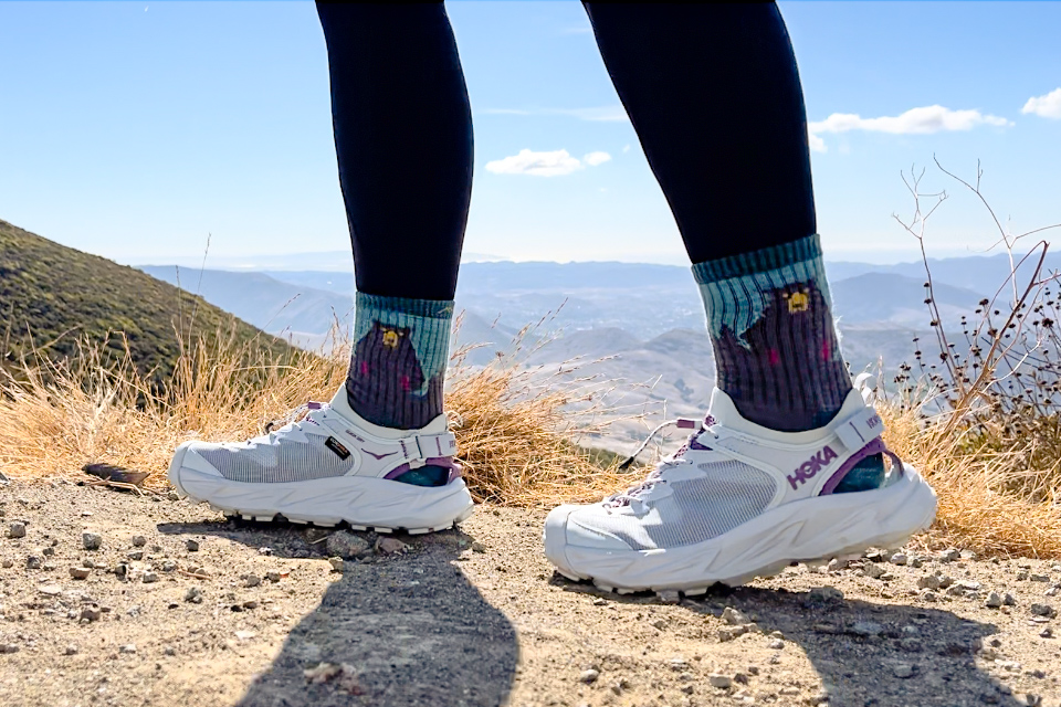 Our tester wearing the HOKA Hopara 2 sandals on a hike.