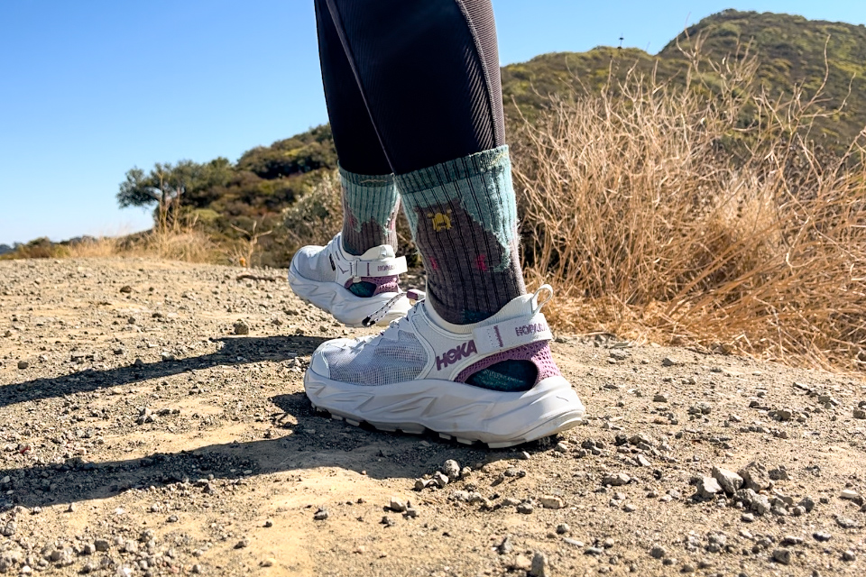 Our tester wearing the HOKA Hopara 2 sandals on a hike.