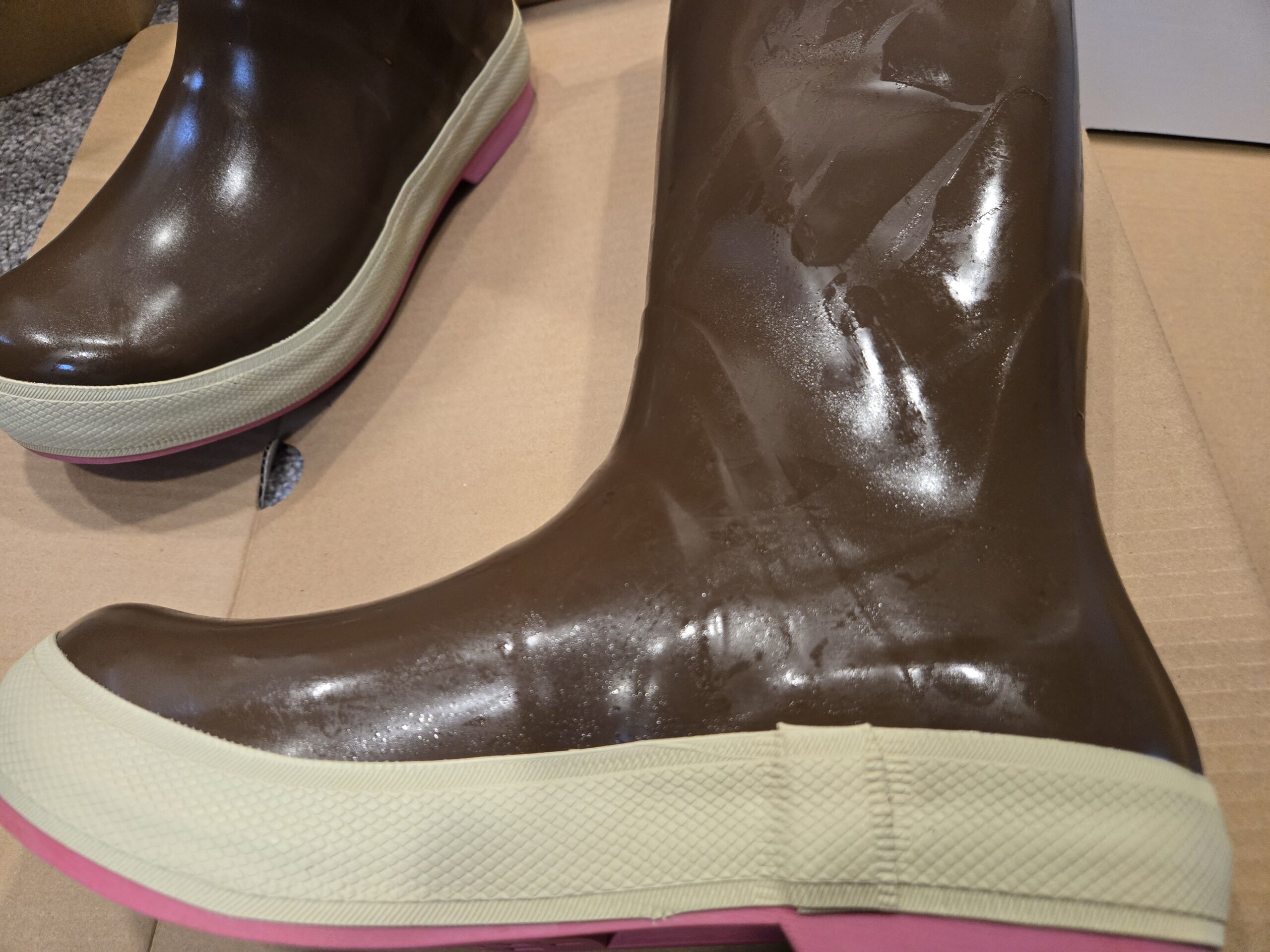 fresh pair of oily xtratuf's on the floor