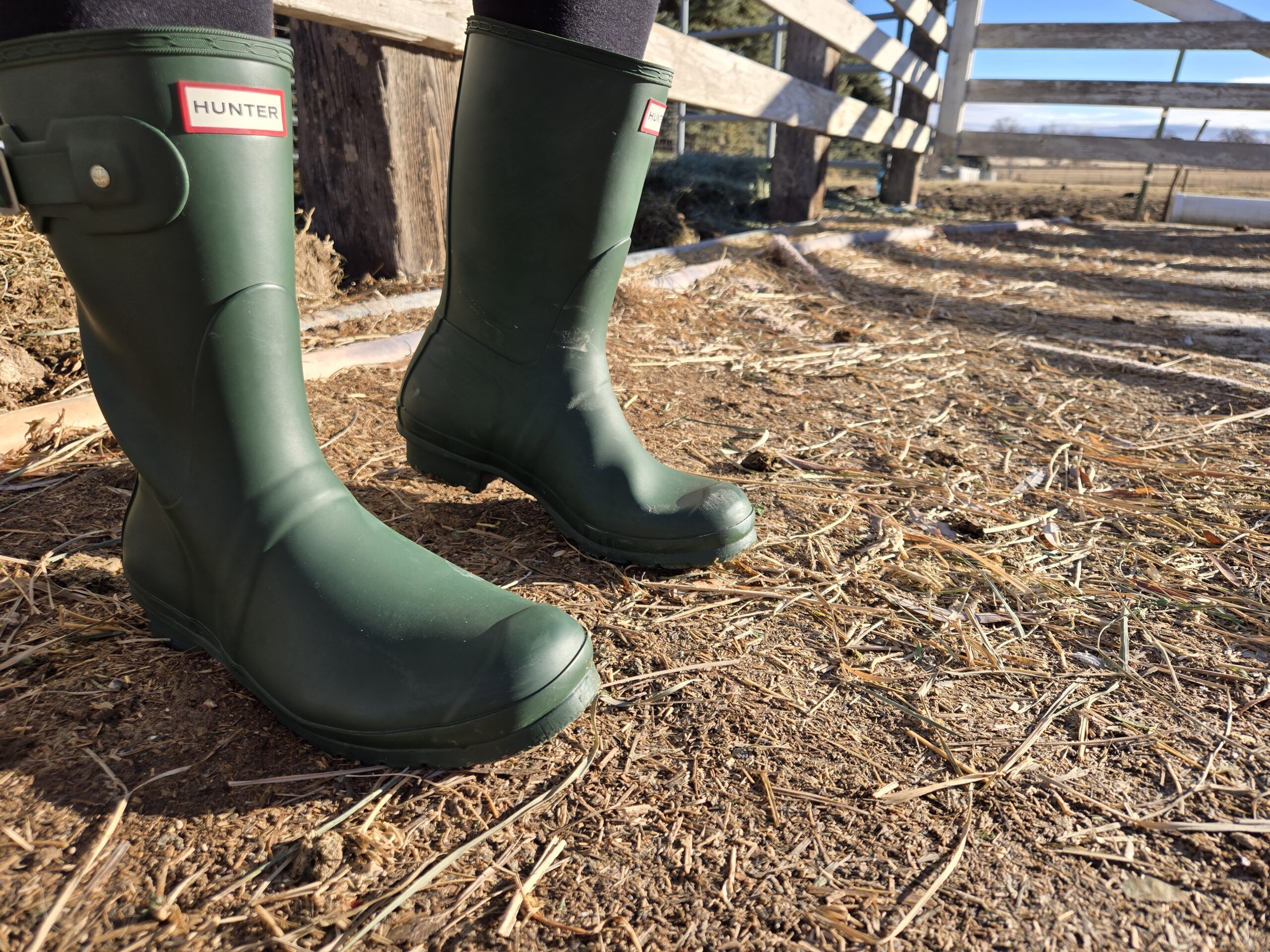a woman in hunter original rain boots