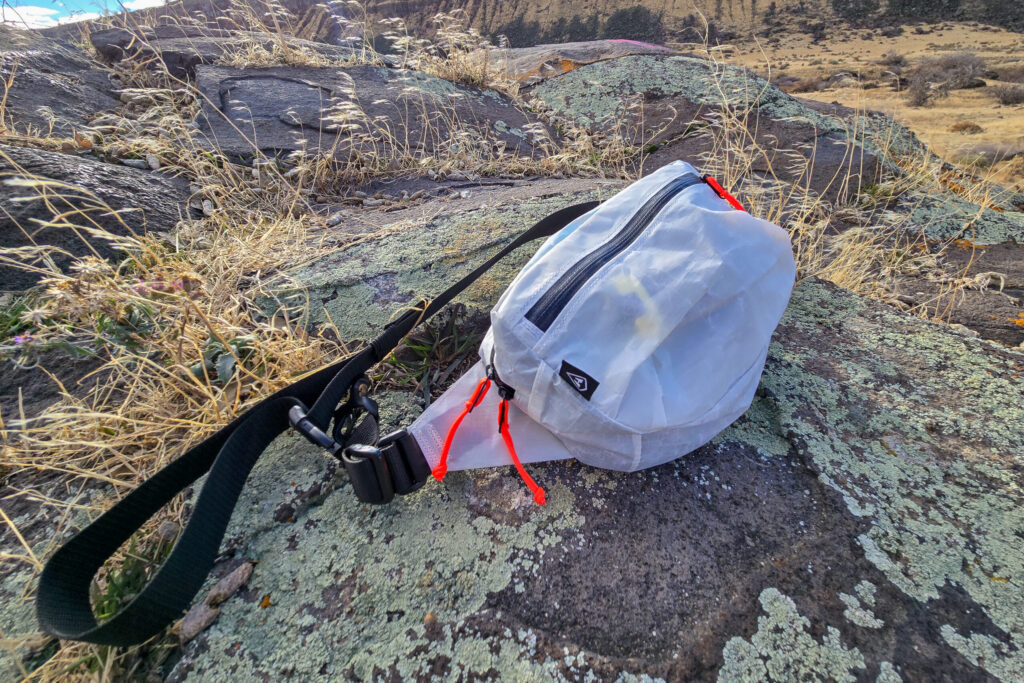 the versa fanny pack by hyperlite mountain gear resting on a rock