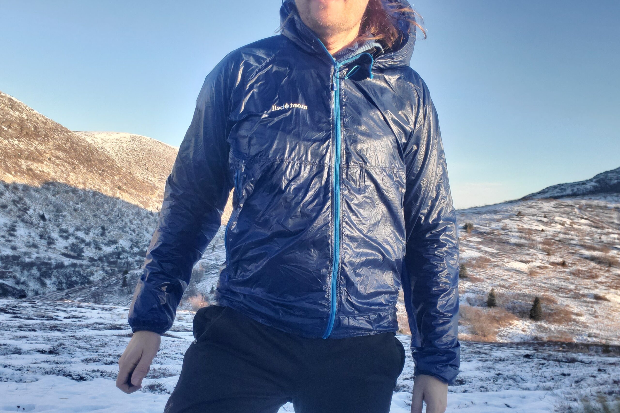 A closeup of the front of a blue windbreaker.