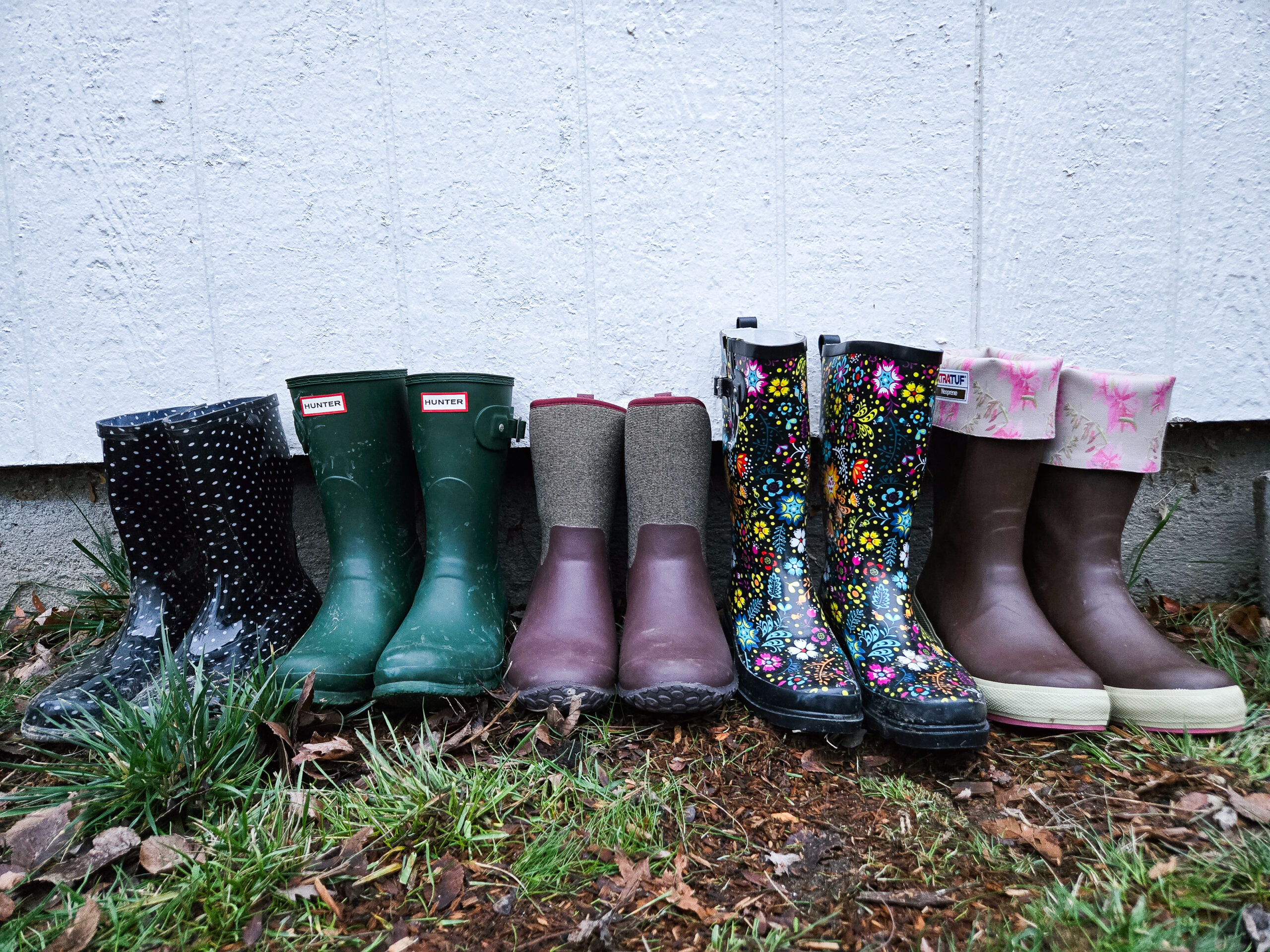 a lineup of many pairs of the best rain boots we tested this year