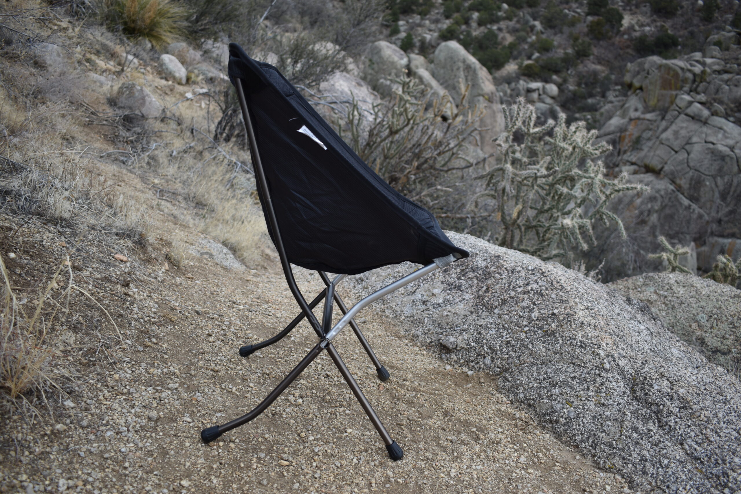 side view of the Big Agnes backpacking chair against a desert canyon backdrop