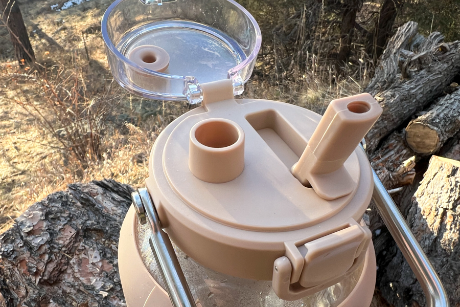 Overhead shot of the BLUEGO water bottle's lid with a straw spout and additional opening.