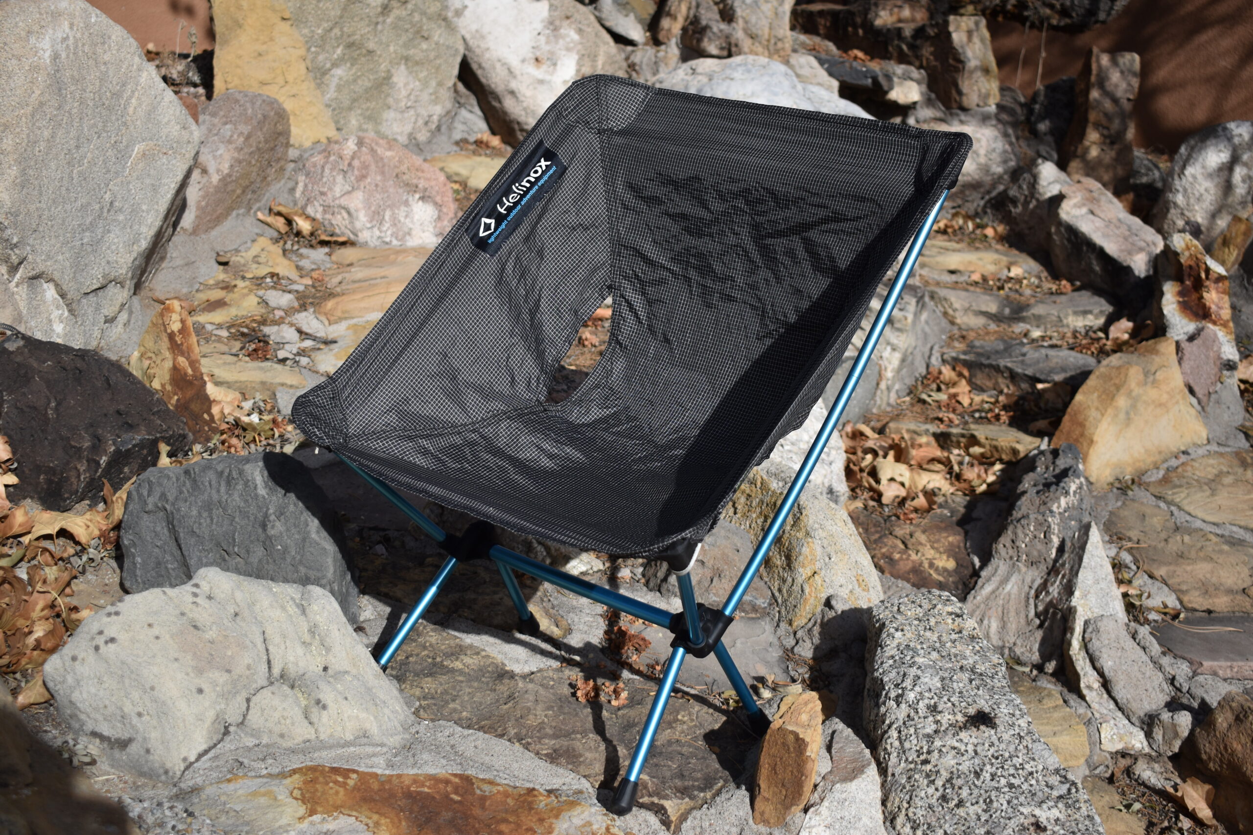 Helinox Ground Chair sits on a bed of rocks